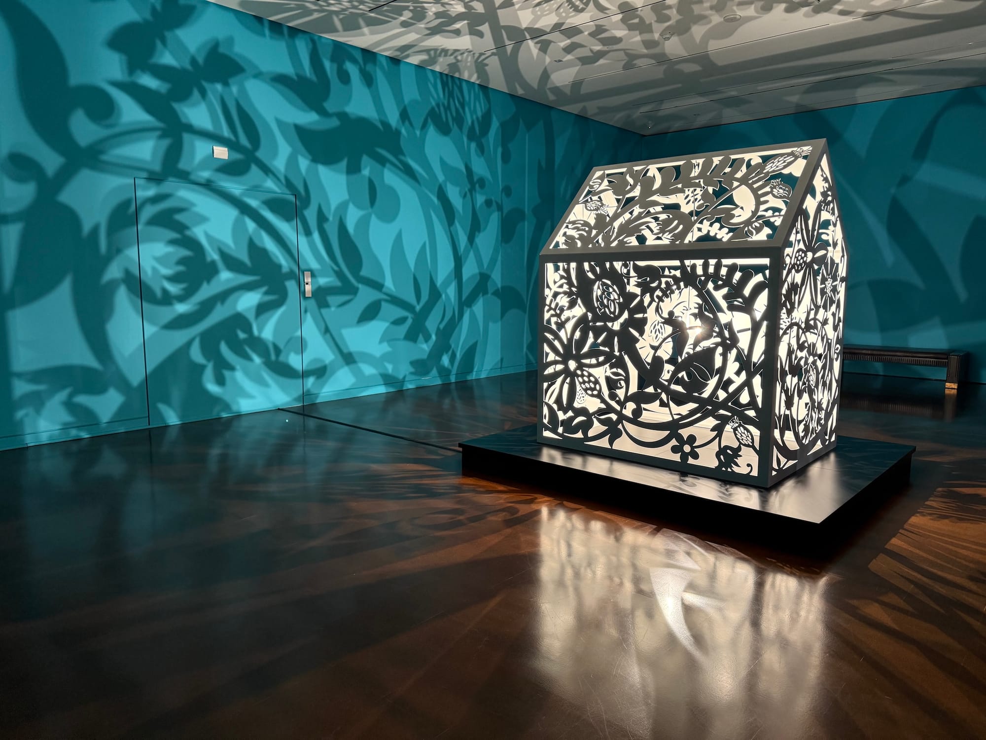 The interior of a gallery with an intricately carved light box