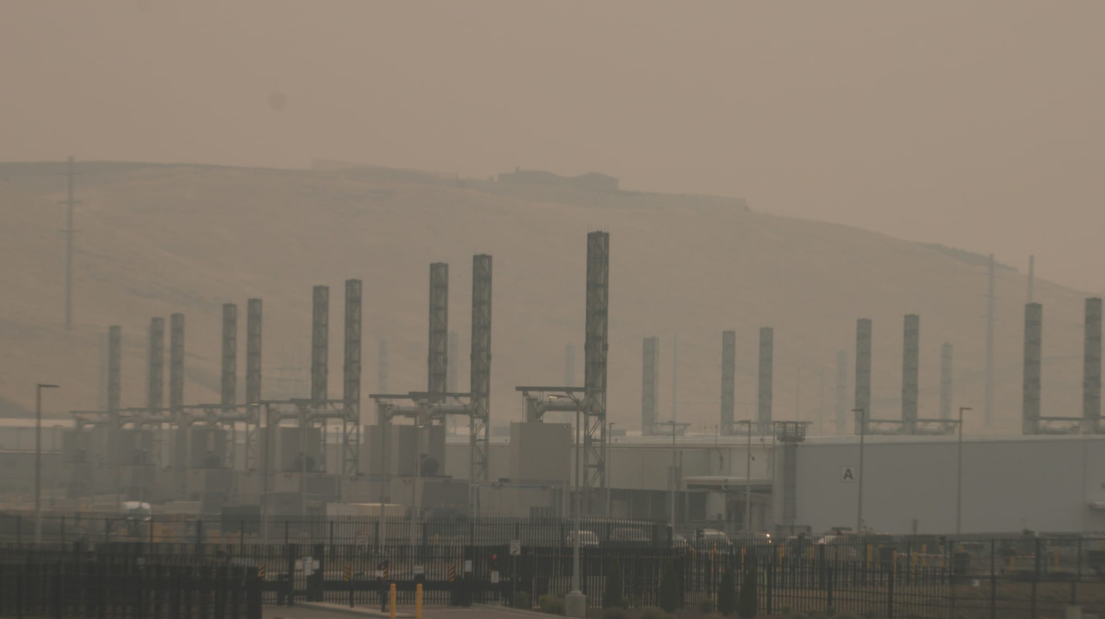 Hazy pollution over a data center in a rural area