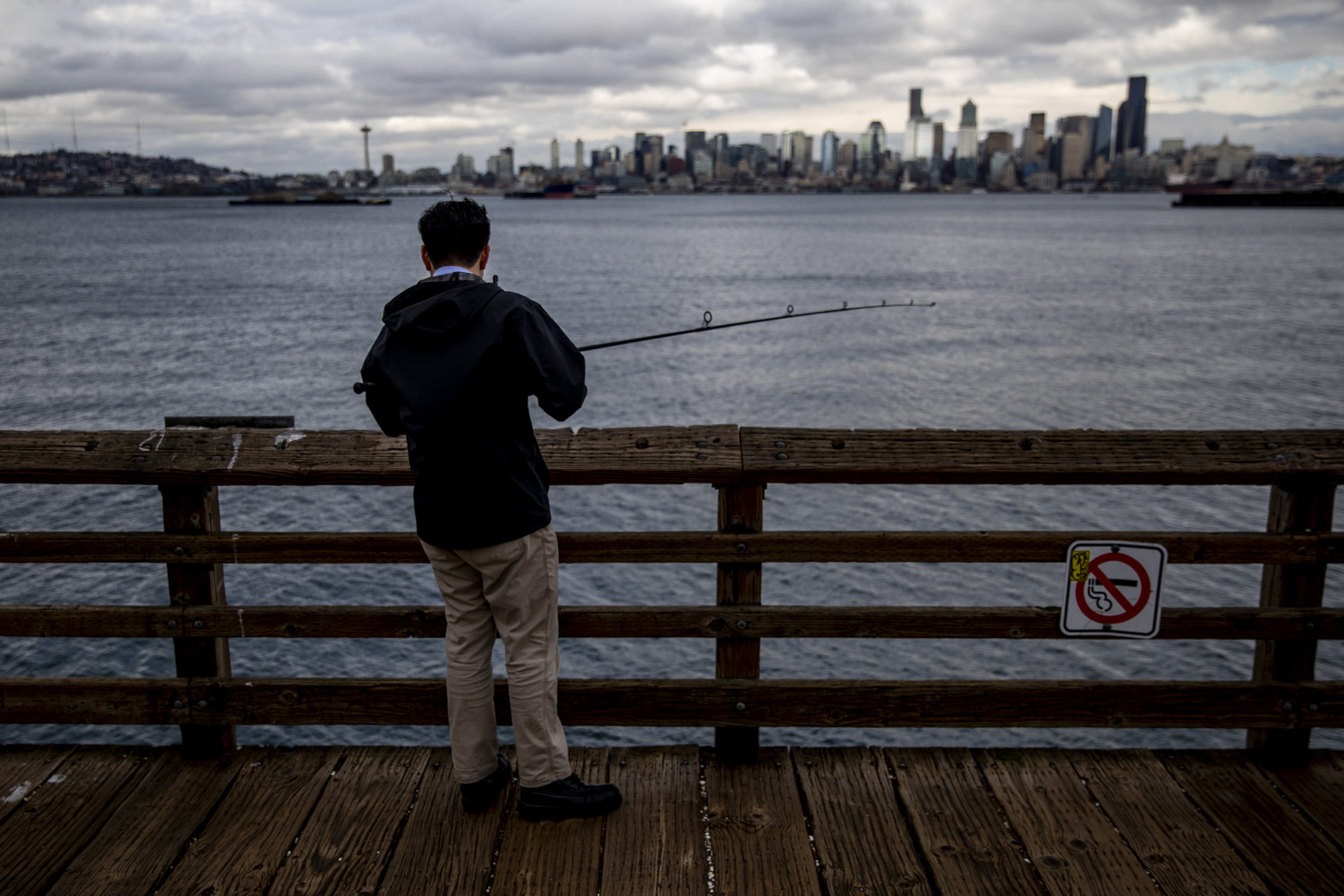 A person fishing in the Sound