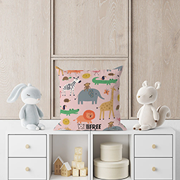 A cushion with cartoon animals on it, on top of a dresser