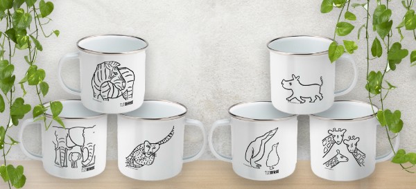 A photo of the full range of enamel mugs, stacked alongside each other. The mugs vare white and feature animal illustrations by artist, Jane Bristowe.