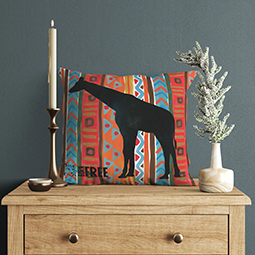 A cushion with giraffe print on a small table