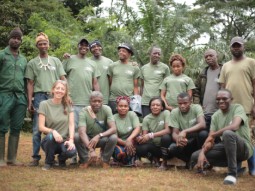 A photo of a group of people, all dressed in the same green Born Free T-shirts, posing for a group photo in Cameroon.