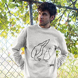 A man wearing a grey sweatshirt with white penguin line drawing 