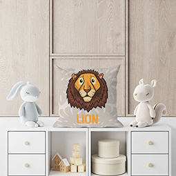 A cushion with a cartoon lion's head on it