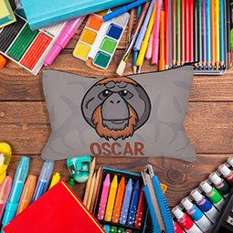 A grey pencil case with cartoon orangutan and the name 'Oscar'