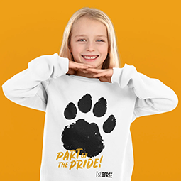 A young girl with blonde hair in a white sweatshirt with par print motif