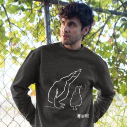 A man wearing a black sweatshirt featuring an illustration of two penguins