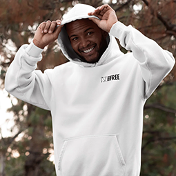 A man in a white hoodie holding up the hood